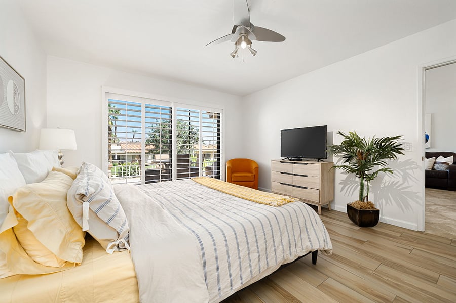 Master bedroom has TV and private access to the patio