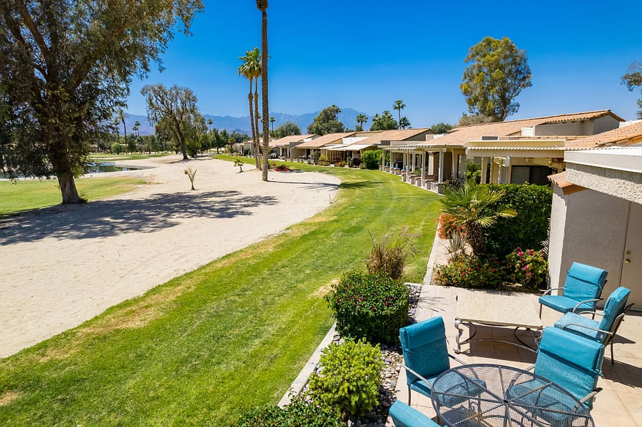 Expansive golf course views and cheery outdoor furniture
