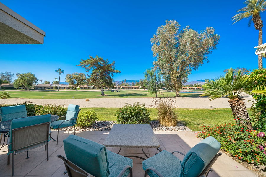 Southwest facing patio overlooks mountains, golf course and lake