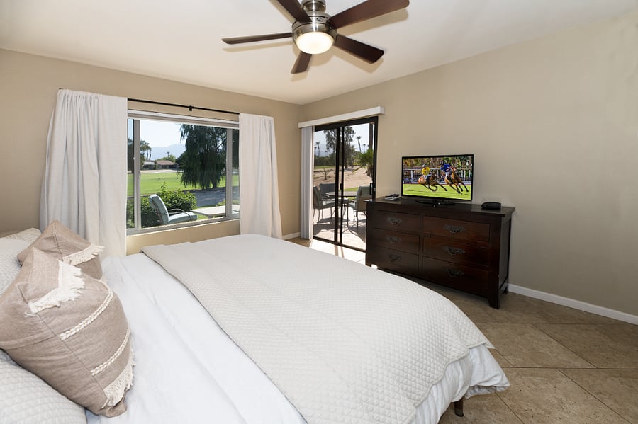 Primary Bedroom has direct access to patio and large window