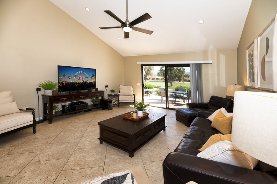Living room with cathedral ceilings and views of golf course
