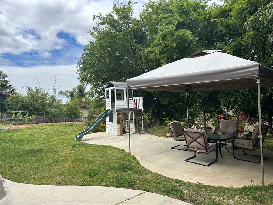 View of private yard from front door of unit