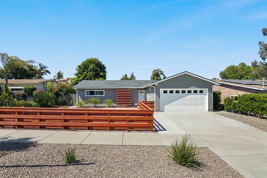 View of the front of the house. Property camera facing street and newly built (lockable) fence provide extra security.