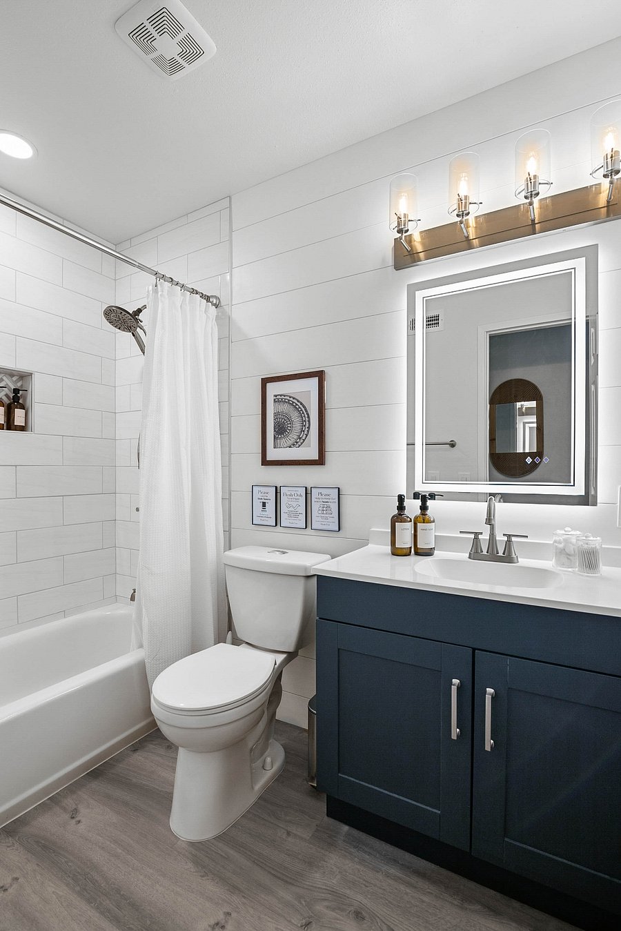 Newly renovated spa-like bathroom. Excellent water pressure with detachable shower head. Bathroom includes lighted mirror with multiple light temperature settings.
