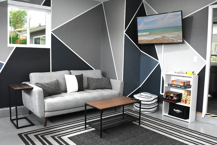 Comfortable game room seating area with smart TV and plenty of games for your enjoyment.
