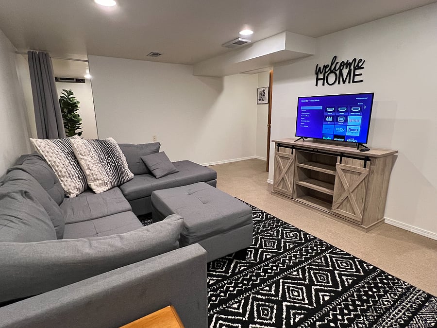 Sitting area in finished basement with 40" Roku TV