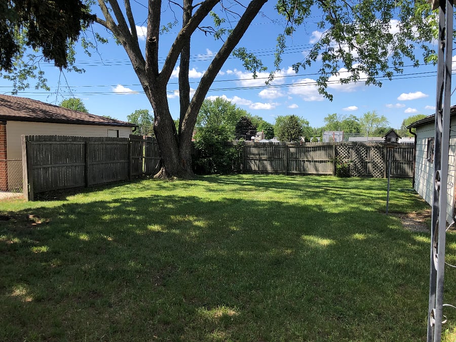 Backyard with fencing on 3 sides