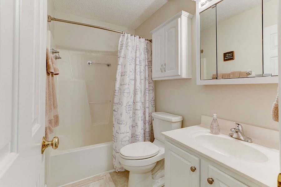 Private full bath/shower with storage cabinets