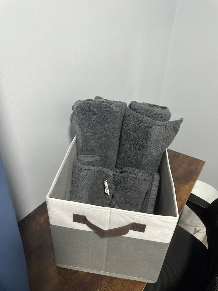 Two sets of bath towels provided.