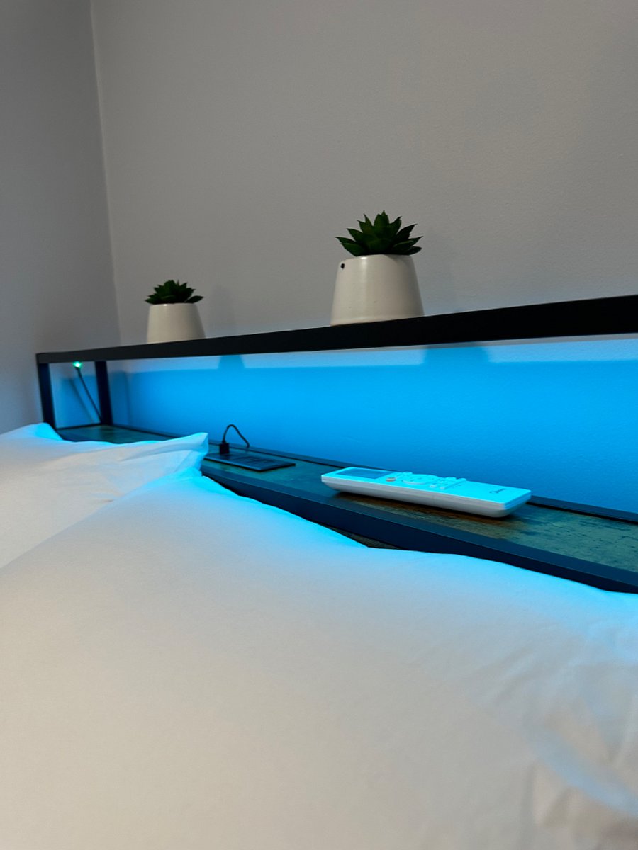 Full sized headboard with light and charging station