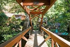 Foot bridge to enter the property. The Cottage can be seen on the left.