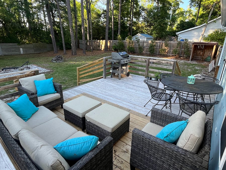Enjoy the back deck, grill, firepit, and large fenced in yard.