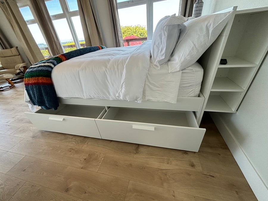 Queen sized bed with extra storage.