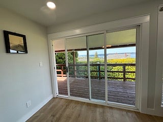 You can open the sliding glass door to walk out directly to the deck to get closer to the water.