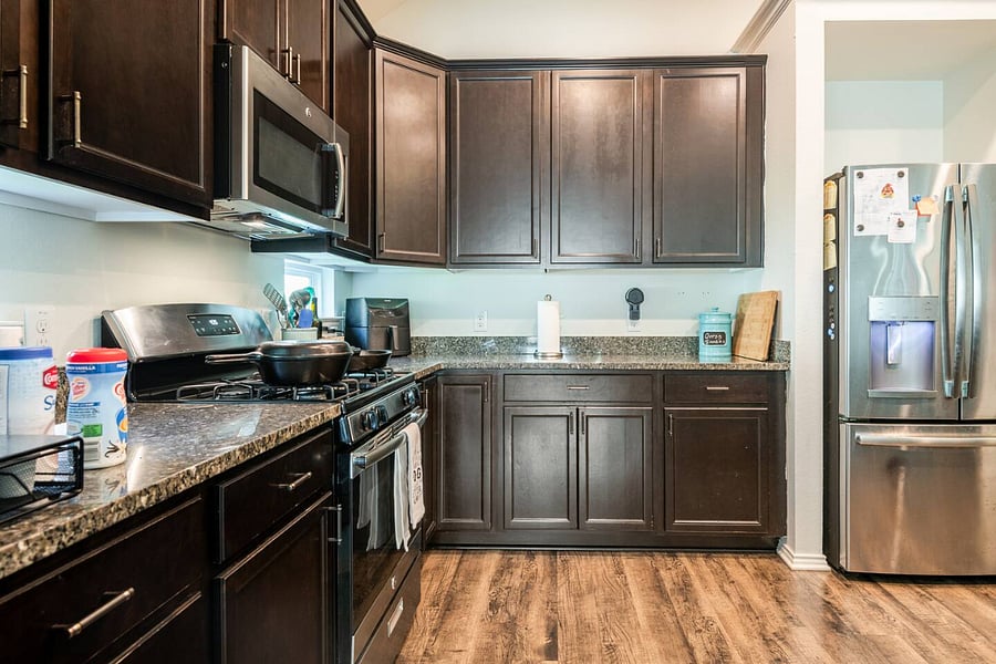 Shared full kitchen with full-size appliances and space to cook.