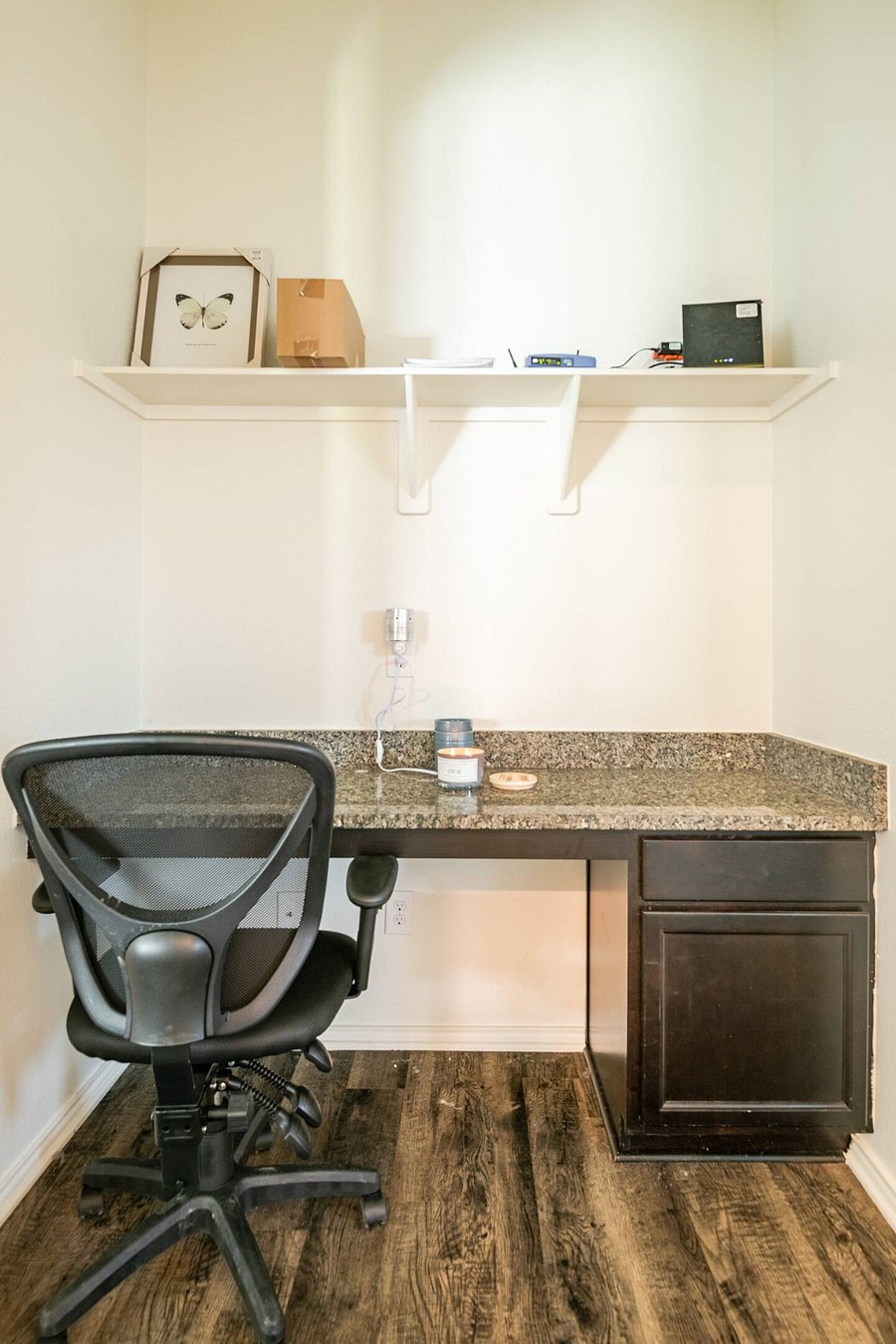 Dedicated workspace with a comfortable chair and enough room to catch up, plan, or get a little work done.