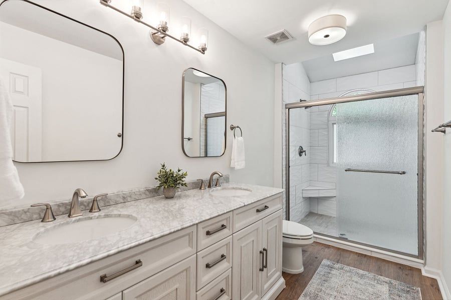 Bathroom #1: En-suite to the primary bedroom, this full bath features a tiled walk-in shower, double vanity, and starter essential toiletries provided.