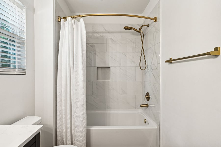 Bathroom #2: A full bath with a tiled tub/shower combo with starter essential toiletries provided. This bathroom is shared by the upstairs bedrooms.