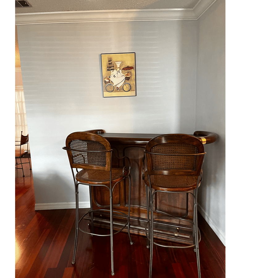 Solid Wood Bar. Storage behind. 2 bar stools wrought iron trim.