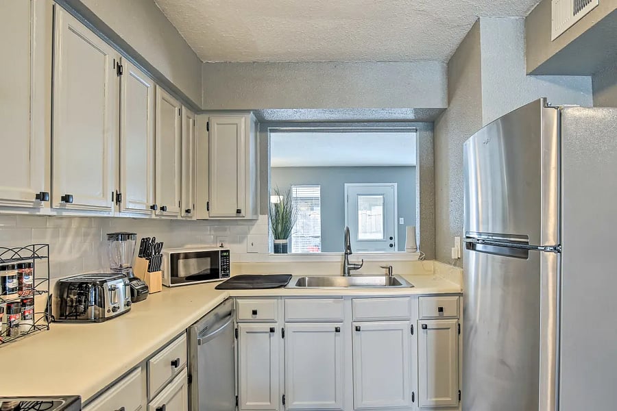 The kitchen comes with stainless steel appliances and looks into the living room so you can cook while your favorite show is on.