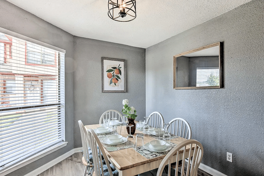 The open plan kitchen flows into the dining room with comfortable seating for 6 and tons of natural light.