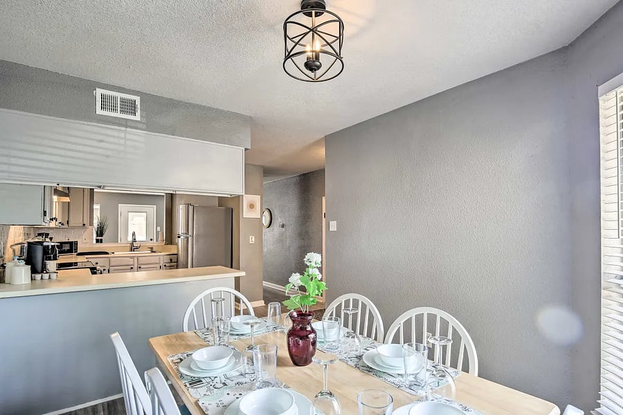 The open plan kitchen flows into the dining room with comfortable seating for 6 and tons of natural light.