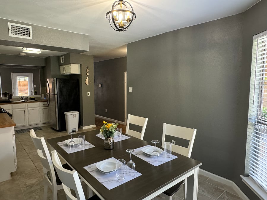 The open plan kitchen flows into the dining room with comfortable seating for 4 and tons of natural light.