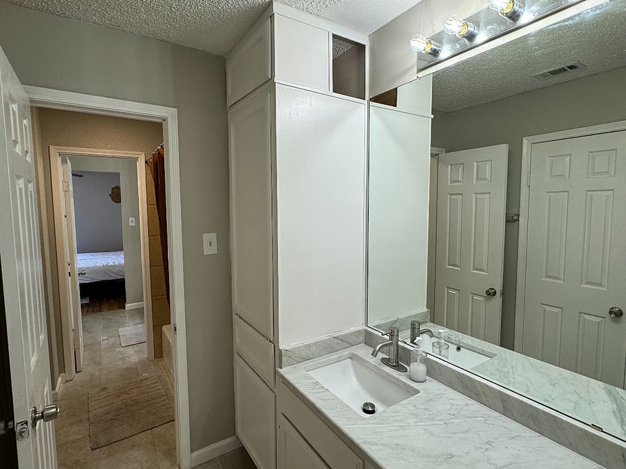 Each bedroom has a private sink, large mirror, towels, plenty of storage and a spacious walk-in closet, just for you! There is a jack and jill bathroom with a shower/tub and toilet.