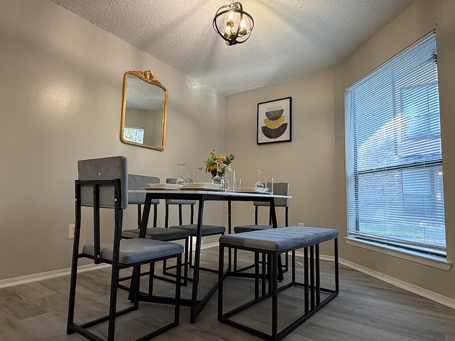 The open plan kitchen flows into the dining room with comfortable seating for 4 and tons of natural light.