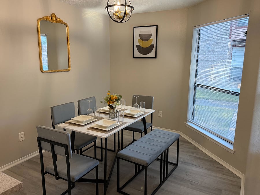 The open plan kitchen flows into the dining room with comfortable seating for 4 and tons of natural light.