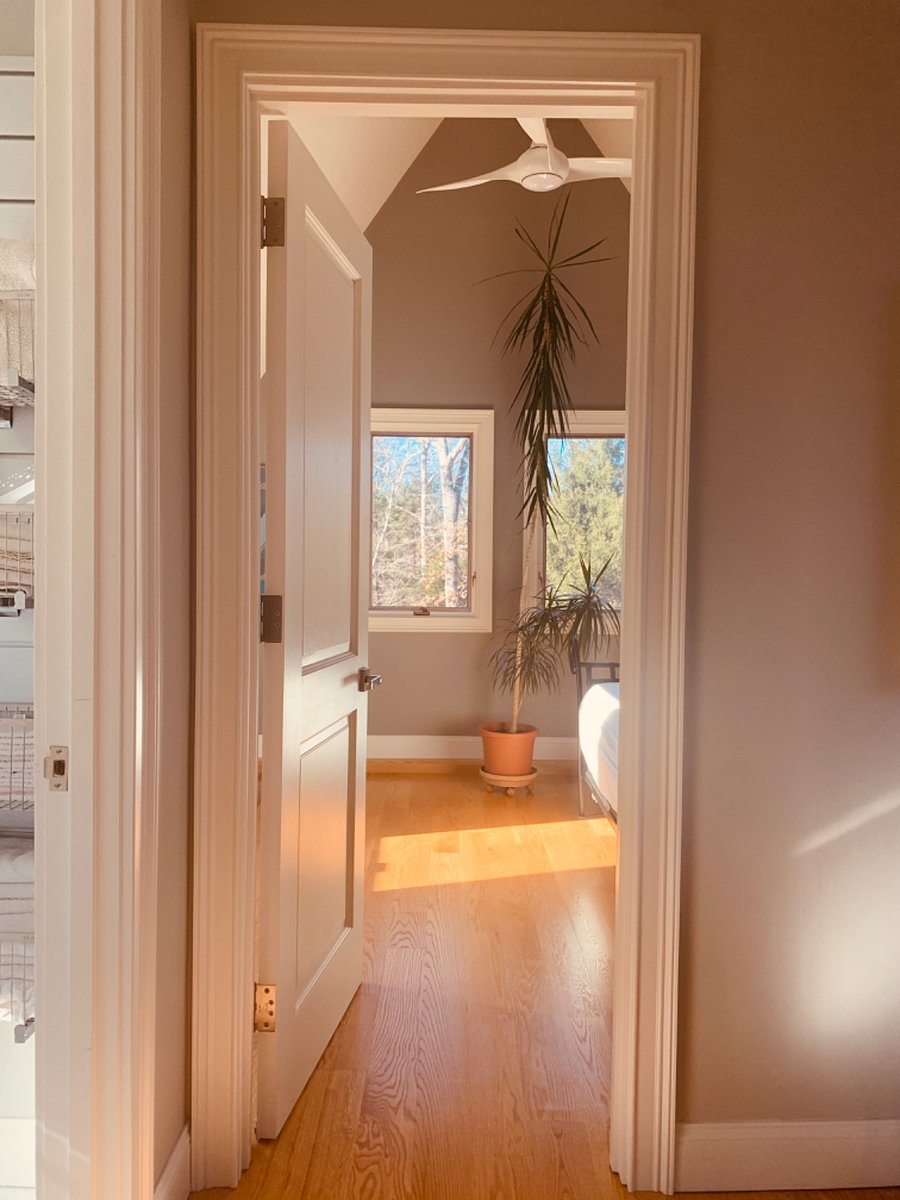 Entrance to West side bedroom with bathroom door to the right.