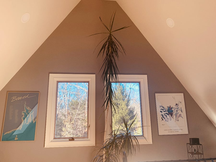 West side bedroom vaulted ceiling with fan.