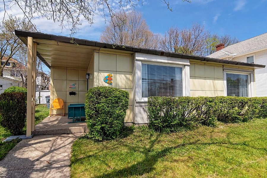 Street view of enameled home built by the Lusrton Corp in Columbus, Ohio during the post-WWII housing boom