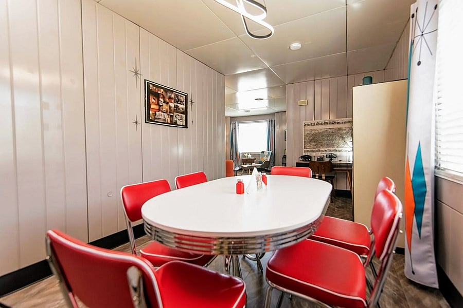 Notice how the light floods in from the large windows featuring darkening drapes for privacy and rest
