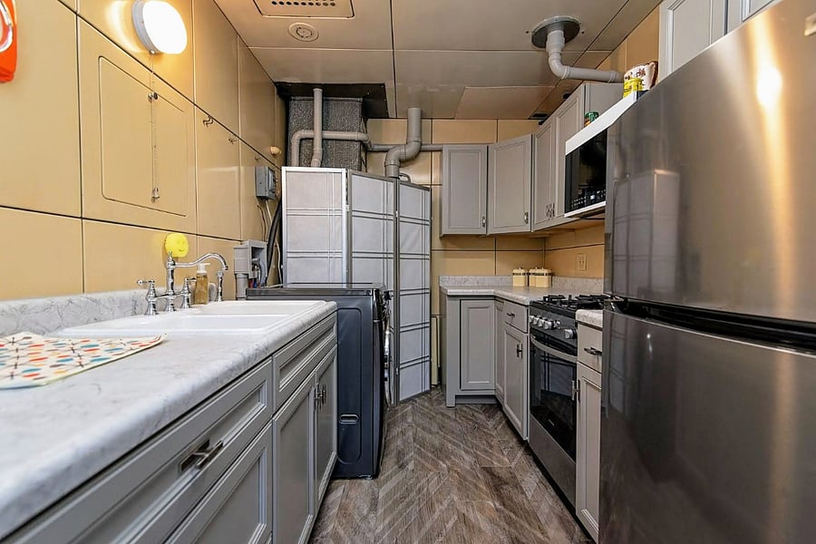 Galley kitchen is easy to maintain and well stocked