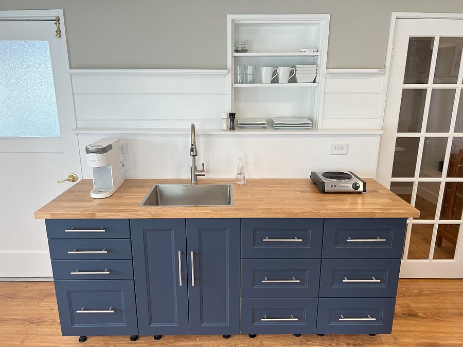 Kitchenette with Keurig coffee machine, full sized sink with pull down spray, cooktop, fully provisioned