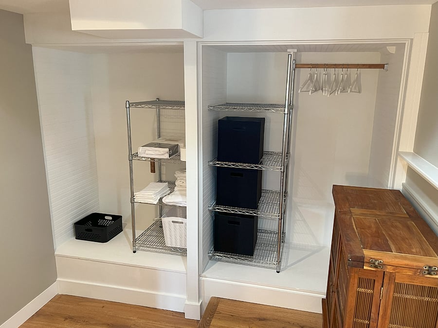 Plenty of storage, shelves, bins, and hanging closet space
