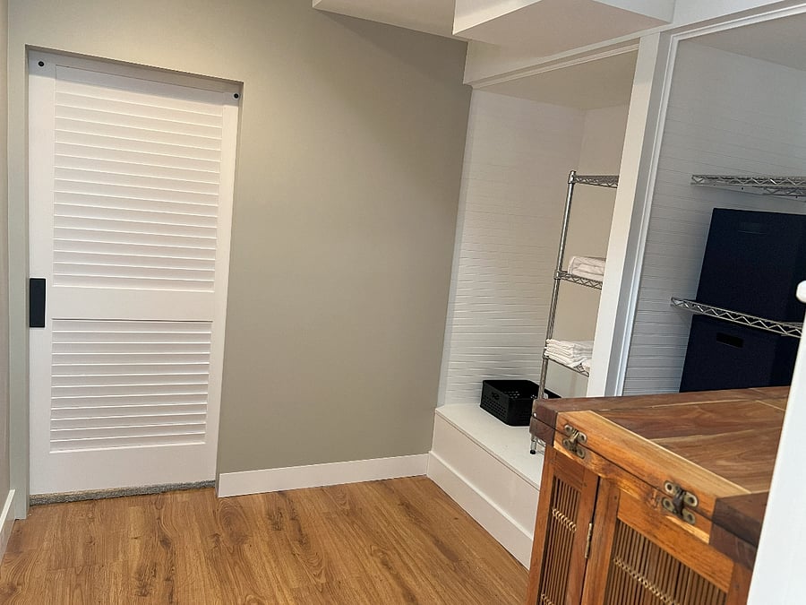 Sliding Barn door, leads to communal Washer / Dryer Laundry room