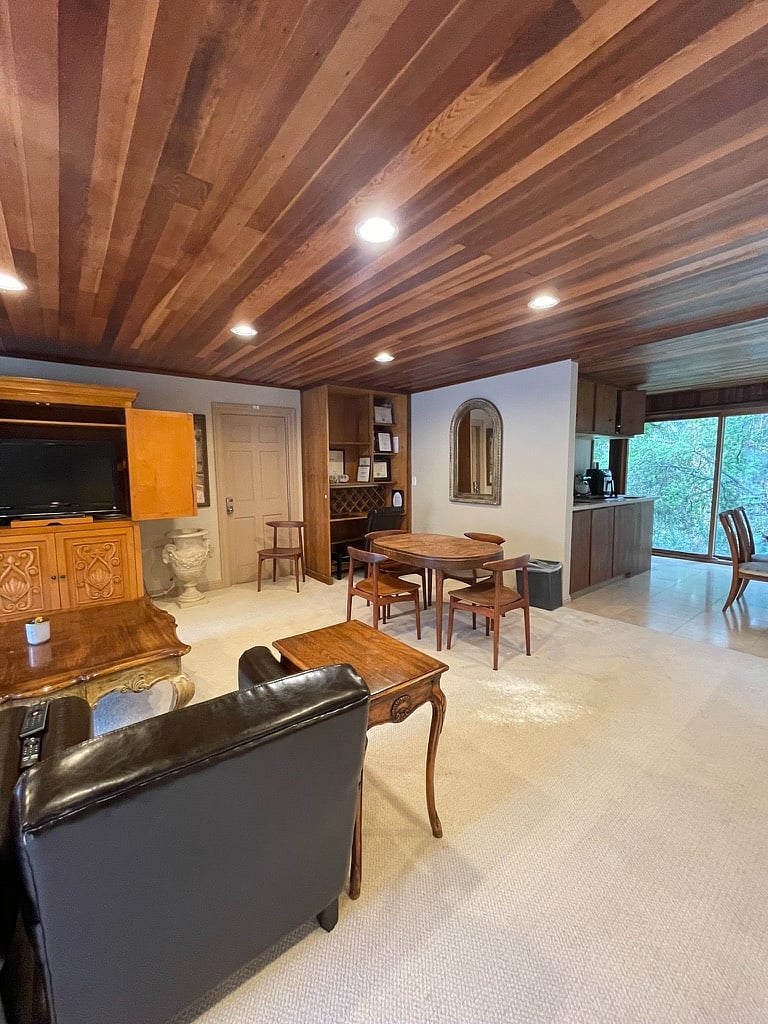 second desk area and kitchen with the forest view