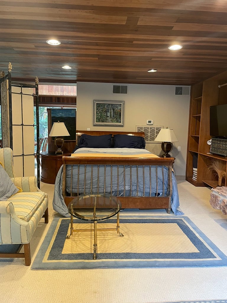 queen bed with comforter
and 2nd smart TV in cabinet to the right (Netflix and Prime)