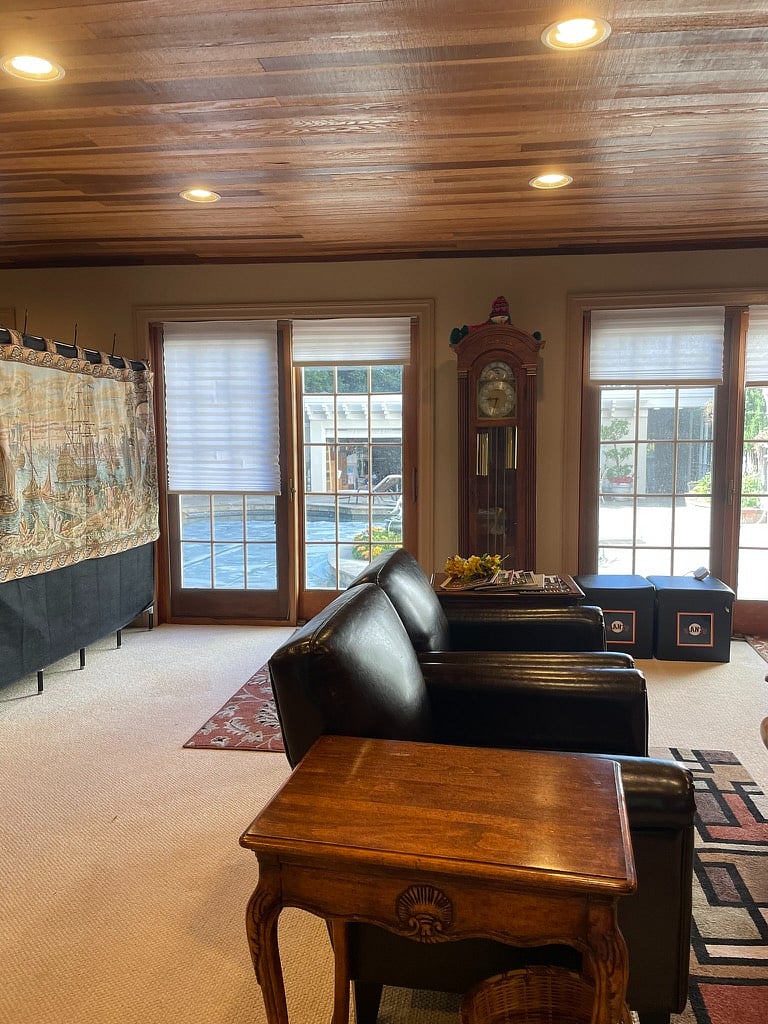 view of the living room to the pool area from the kitchen