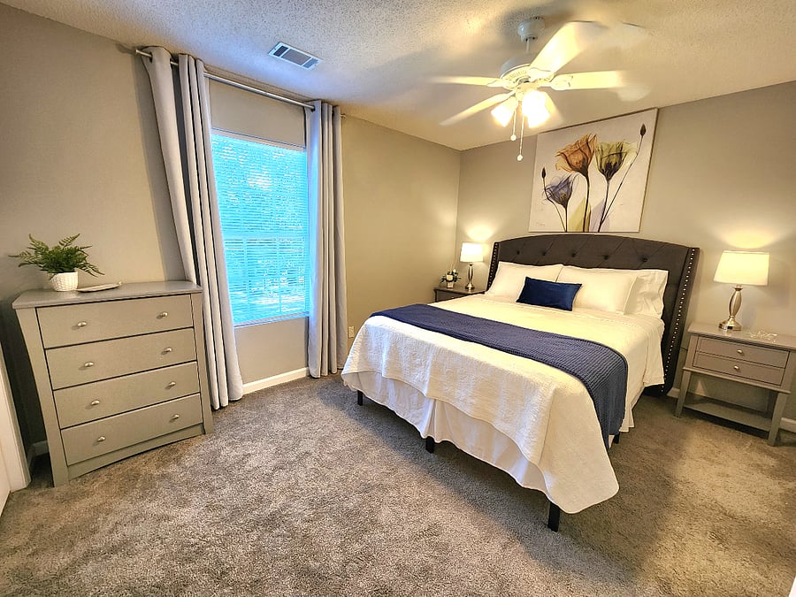 Bedroom 1 with blackout curtains and dresser
