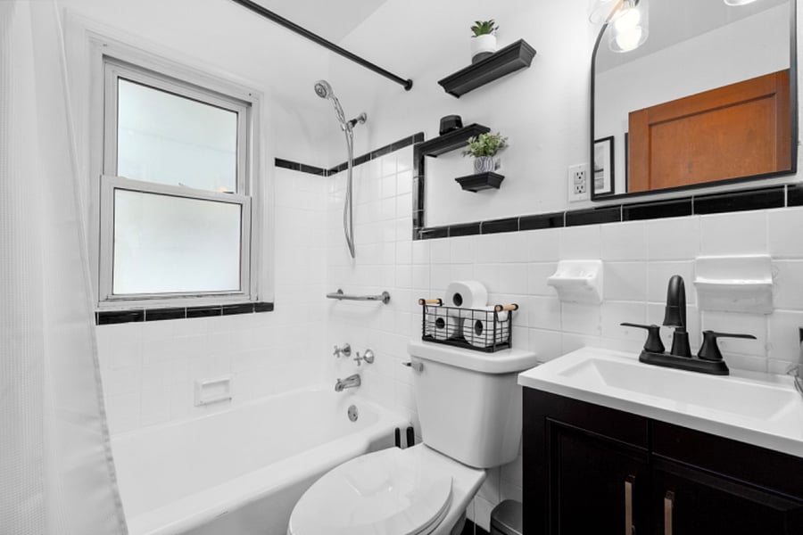 Modern bathroom with adjustable, removable showerhead and modern faucet that lights up while washing your hands during those late night bathroom runs.