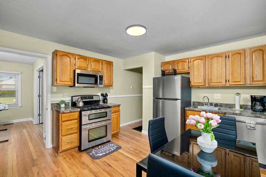 Newly renovated kitchen with stainless steel appliances, dual oven, microwave, dishwasher and full size refrigerator.