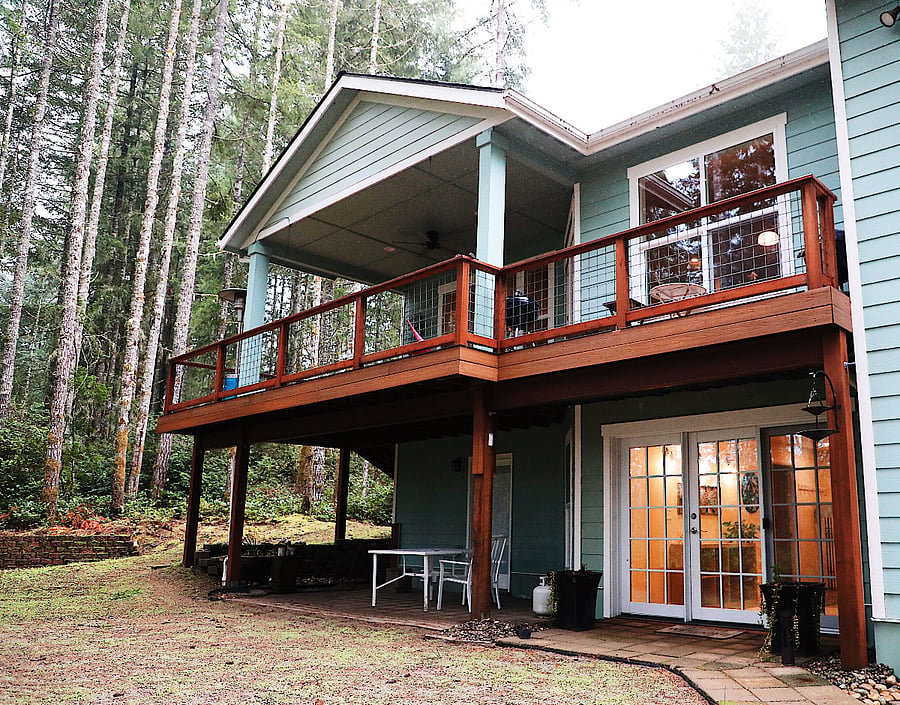 Almost all of the porch is covered. Lawn should be grown in by the time you get here. 