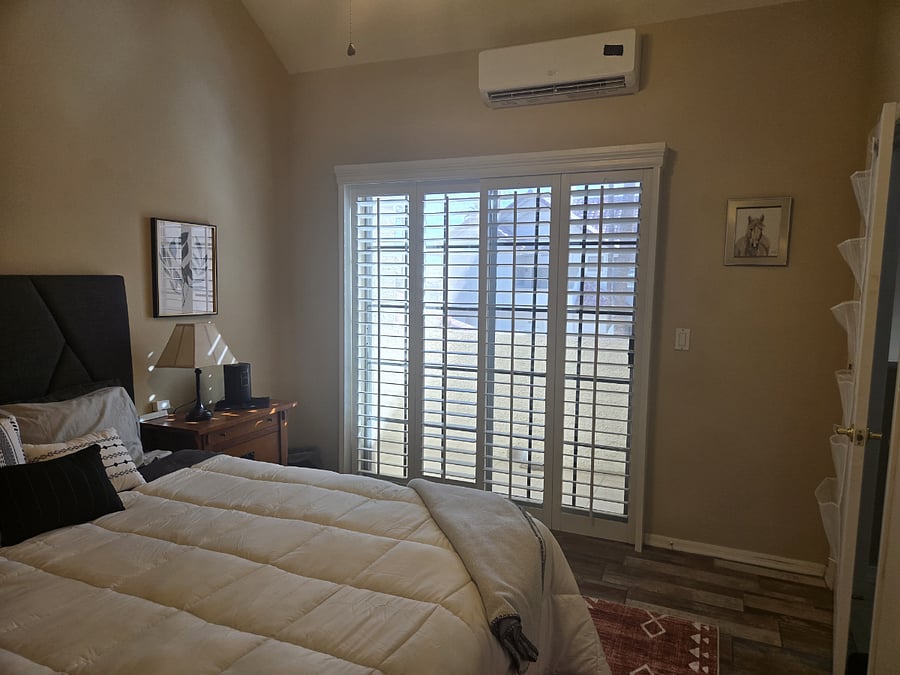 2nd floor queen size bedroom with small balcony.