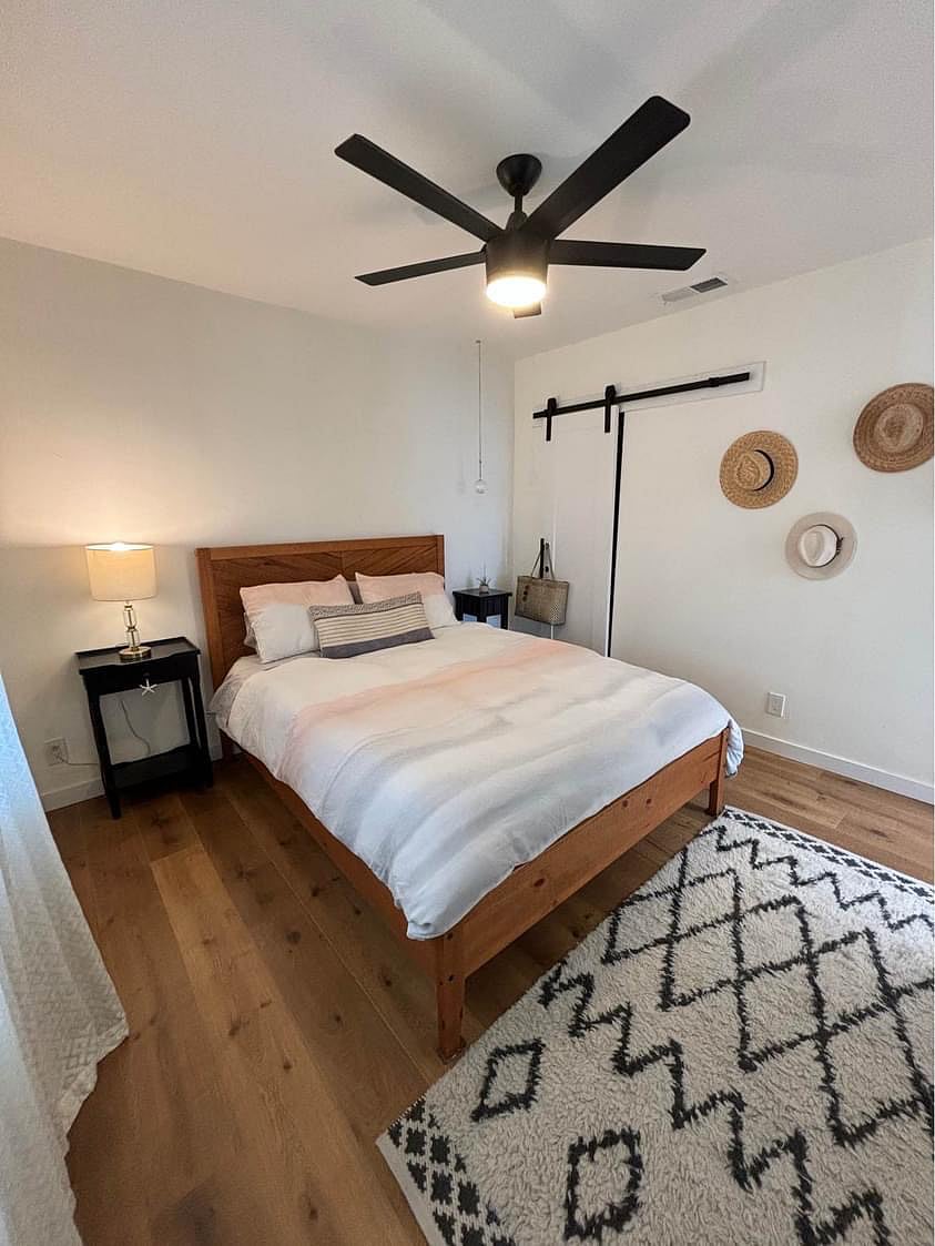 Master bedroom with a closet and large dresser.