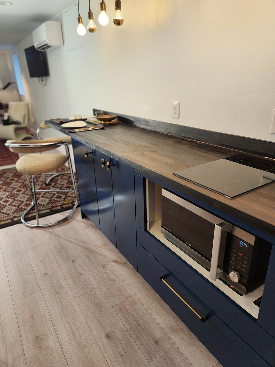 Two burner induction stovetop, plus combination microwave/convection oven.