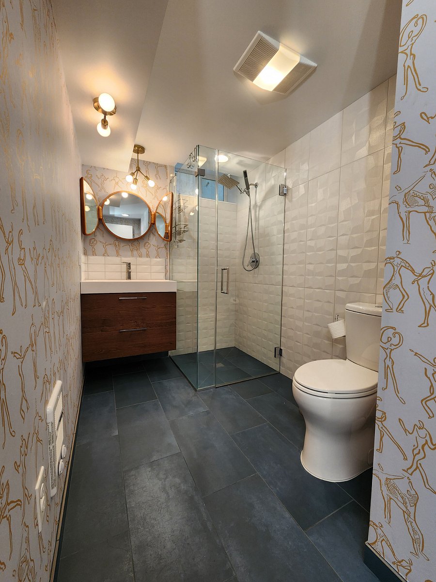 Beautiful bathroom space with plenty of hot water due to tankless water heater.