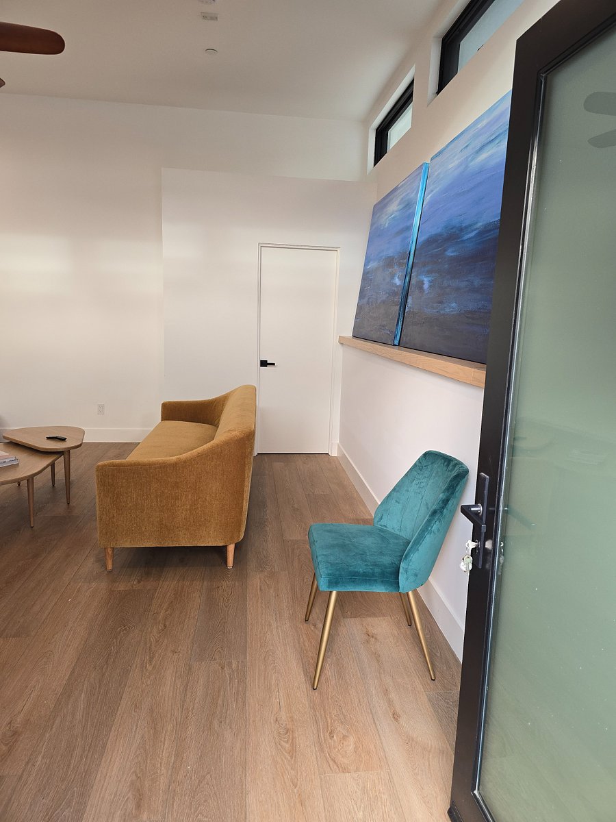 Entrance from the Front Door opens up to the Studio space. There is a 2/3 person couch and coffee table.